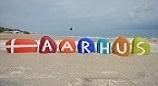 Aarhus sign on a beach
