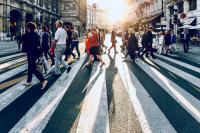 a crowd of people on a pedestrian crossing 